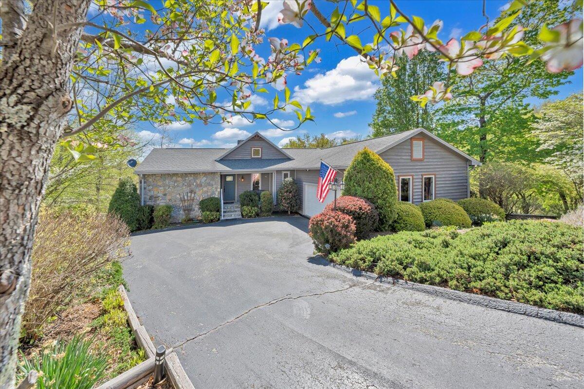 270 Forest Edge Road Wirtz, VA 24184 - Photo 74 of 79 a front view of a house with a yard and fountain