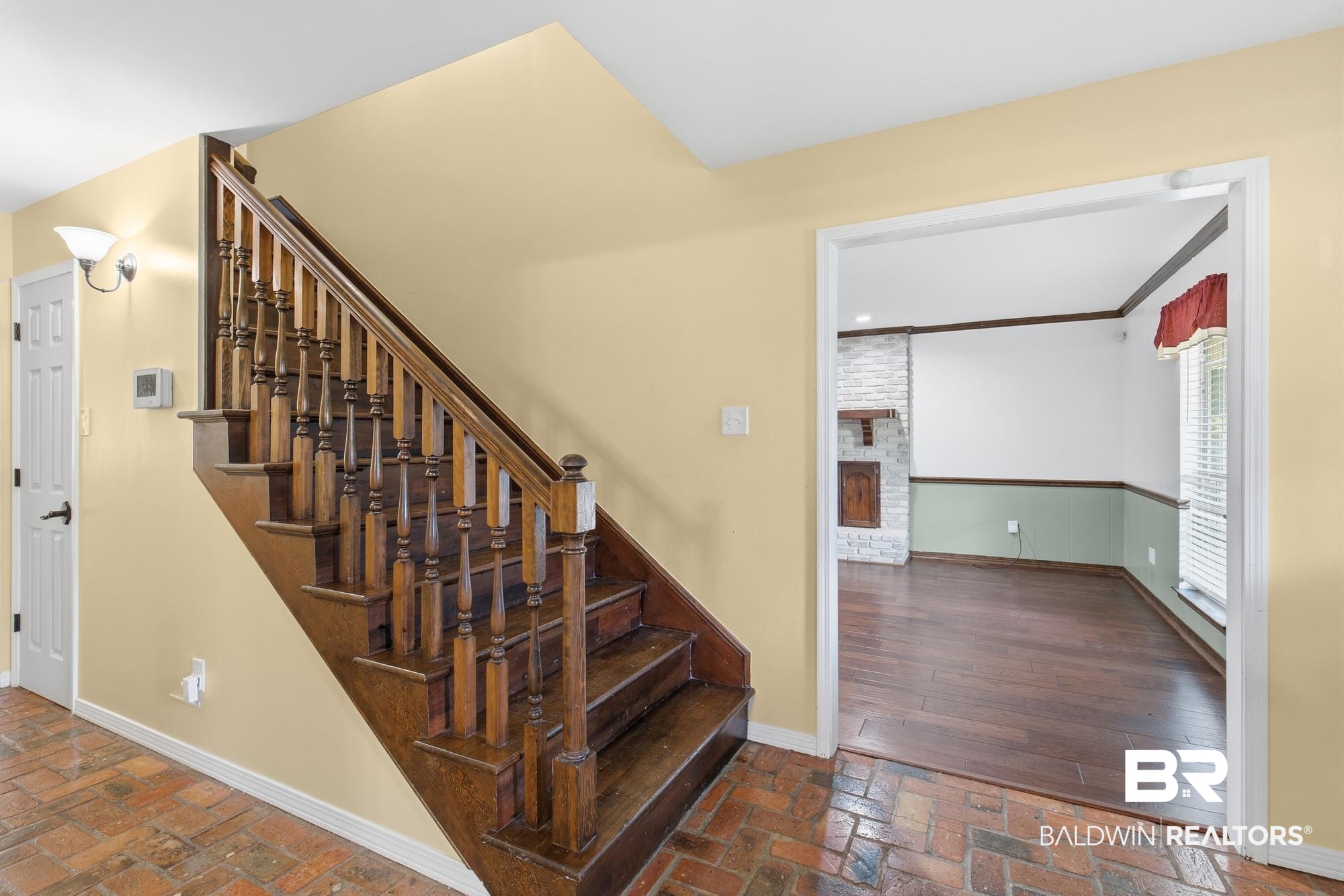 9215 Shiloh Drive Mobile, AL 36695 - Photo 11 of 32 Stairway with brick floors and a fireplace