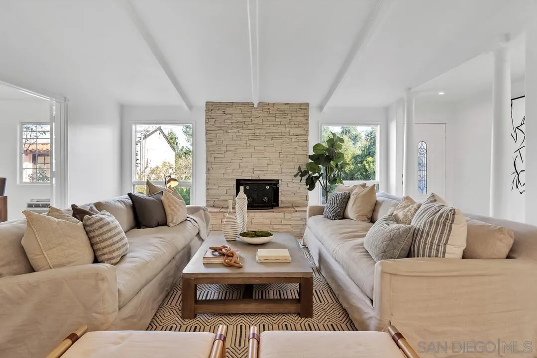 12731 Stone Canyon Road Poway, CA 92064 - Photo 1 of 44 a living room with furniture and a fireplace