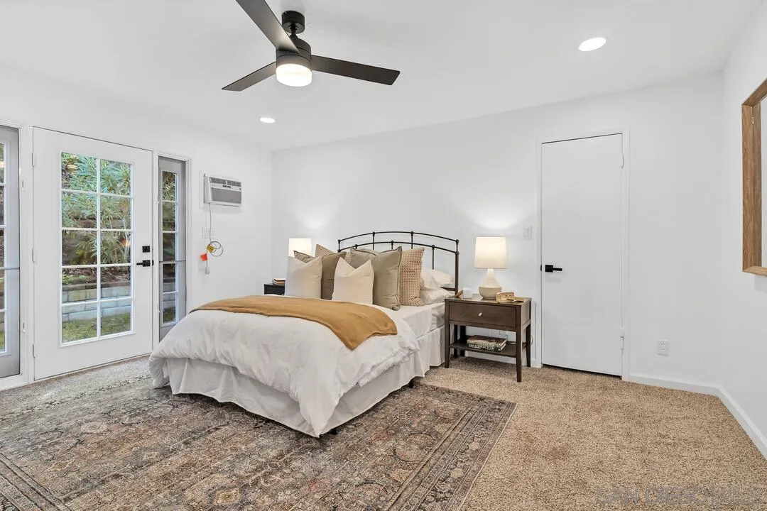12731 Stone Canyon Road Poway, CA 92064 - Photo 14 of 44 a bedroom with a bed and a window