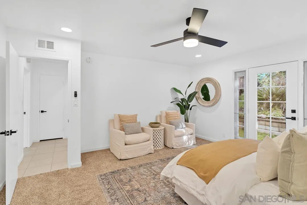 12731 Stone Canyon Road Poway, CA 92064 - Photo 15 of 44 a bedroom with bed and a large window