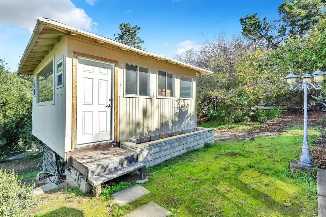 12731 Stone Canyon Road Poway, CA 92064 - Photo 26 of 44 a front view of a house with garden
