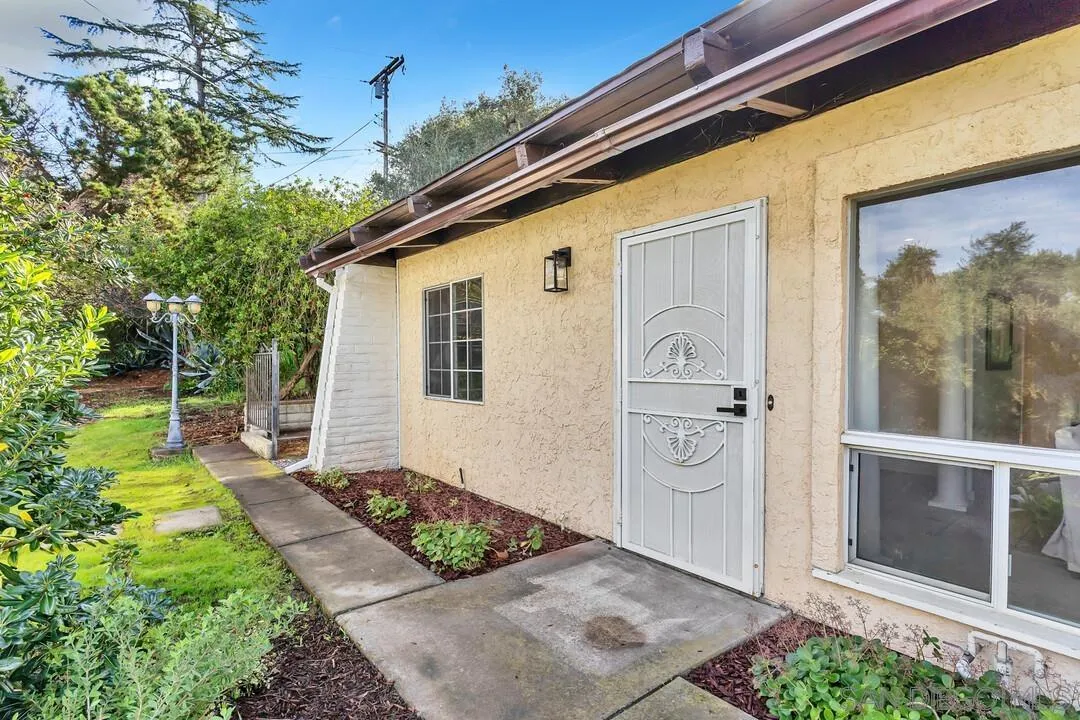 12731 Stone Canyon Road Poway, CA 92064 - Photo 27 of 44 a front view of a house with a garden
