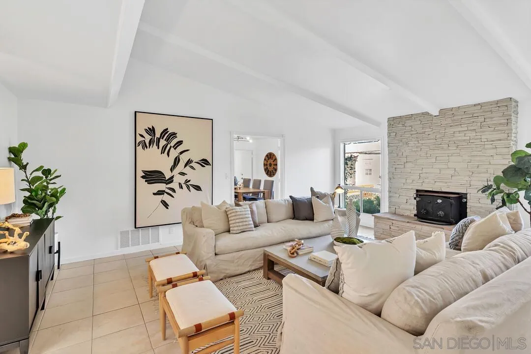 12731 Stone Canyon Road Poway, CA 92064 - Photo 3 of 44 a living room with furniture and a fireplace
