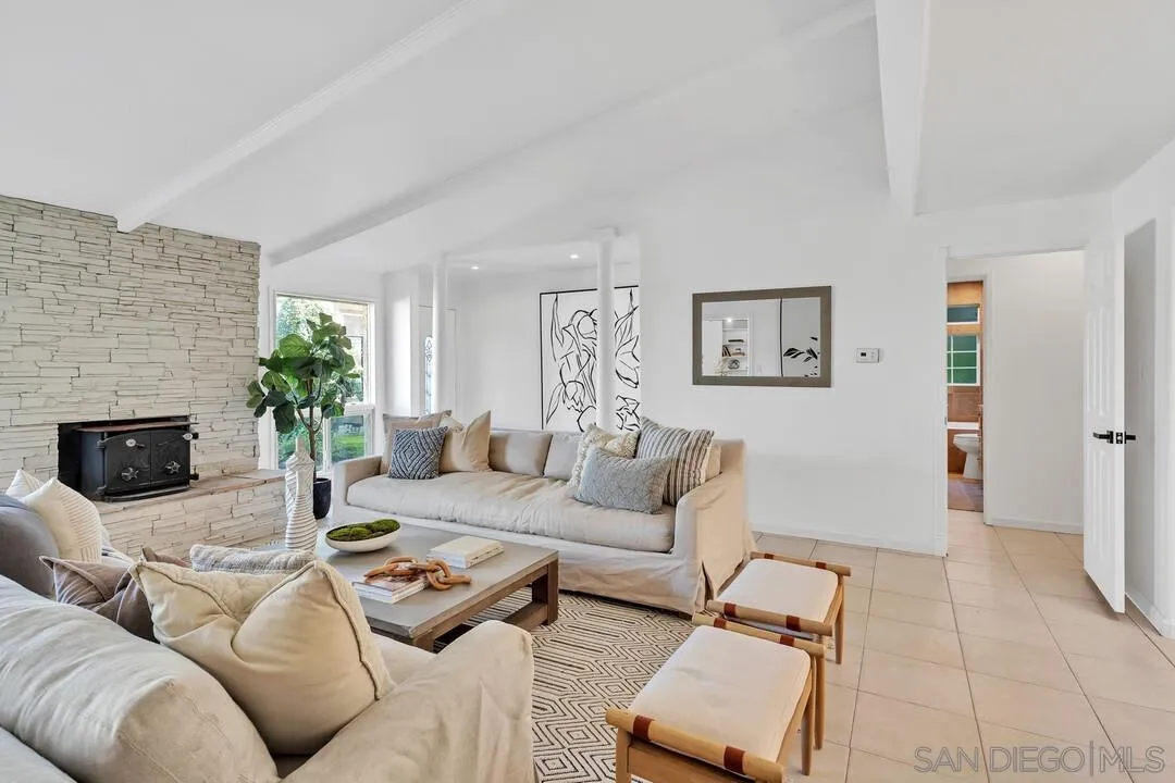 12731 Stone Canyon Road Poway, CA 92064 - Photo 6 of 44 a living room with furniture and a fireplace