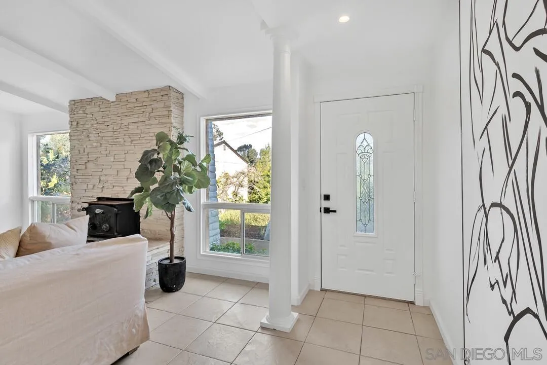 12731 Stone Canyon Road Poway, CA 92064 - Photo 7 of 44 a view of an entryway with a flower pot