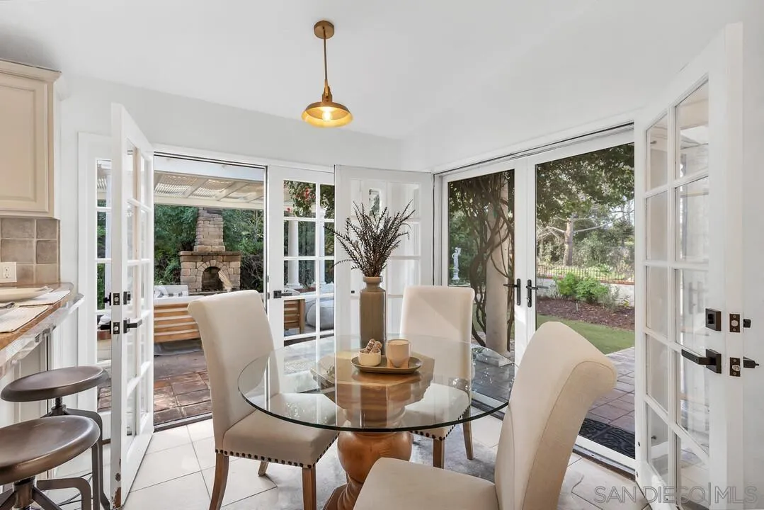 12731 Stone Canyon Road Poway, CA 92064 - Photo 9 of 44 a view of a dining room with furniture wooden floor and chandelier