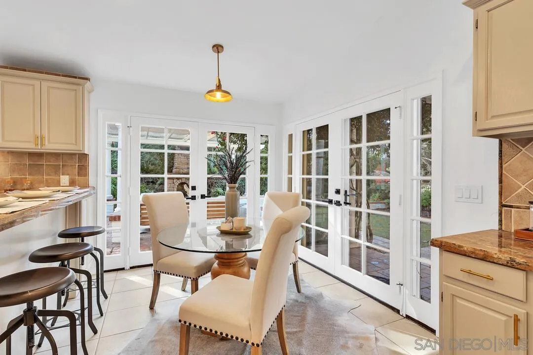 12731 Stone Canyon Road Poway, CA 92064 - Photo 10 of 44 a view of a dining room with furniture window and outside view