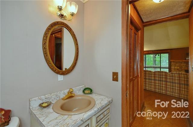 55 Summit Road Tryon, NC 28782 - Photo 15 of 23 a bathroom with a sink and a mirror