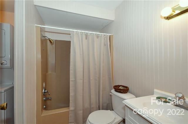 55 Summit Road Tryon, NC 28782 - Photo 17 of 23 a bathroom with a granite countertop toilet and a sink