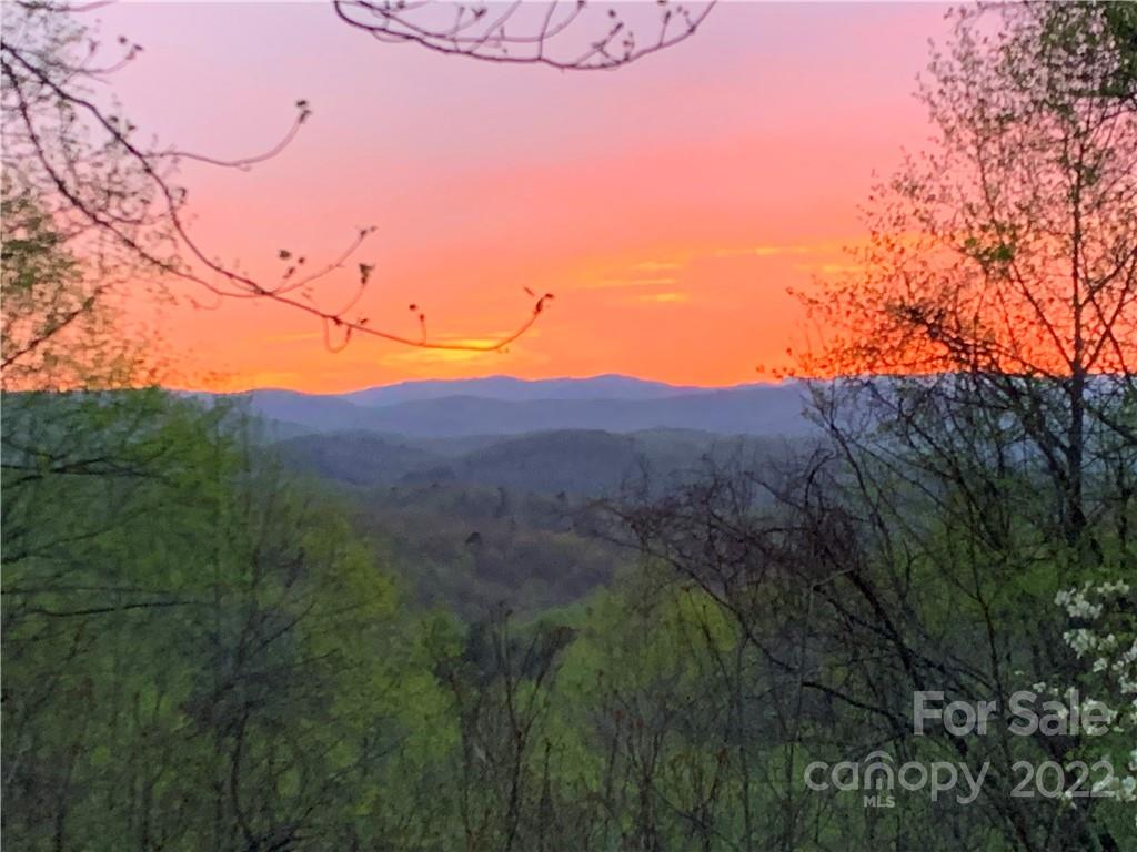 55 Summit Road Tryon, NC 28782 - Photo 2 of 23 a view of a lake with a mountain in the background