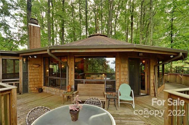 55 Summit Road Tryon, NC 28782 - Photo 5 of 23 a backyard of a house with yard barbeque oven and outdoor seating