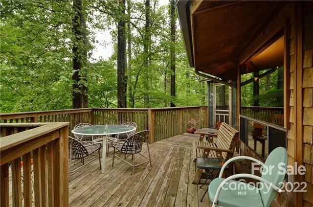 55 Summit Road Tryon, NC 28782 - Photo 6 of 23 a view of a balcony with chairs