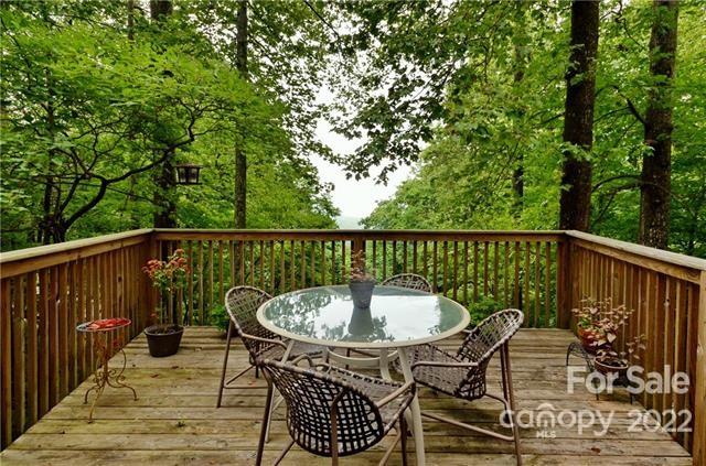 55 Summit Road Tryon, NC 28782 - Photo 7 of 23 a view of a chair and table on the deck