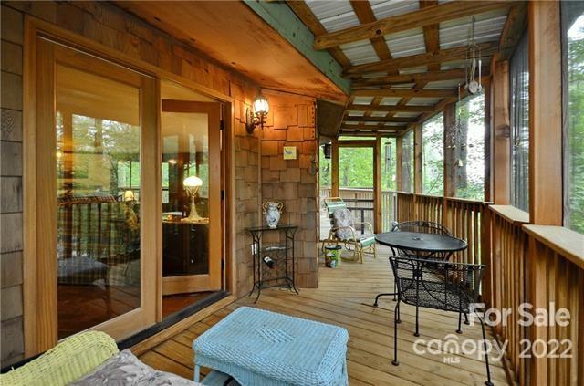 55 Summit Road Tryon, NC 28782 - Photo 8 of 23 a outdoor space with lots of furniture and windows