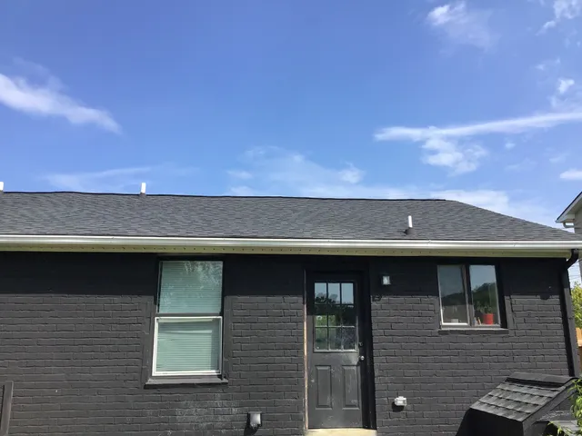 a front view of a house with parking space