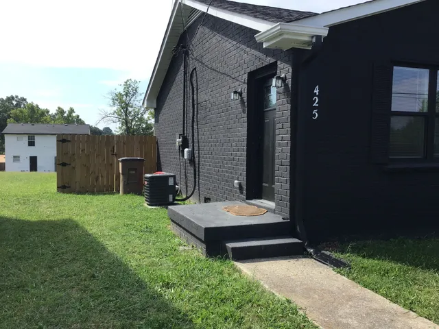 a view of backyard with a tub