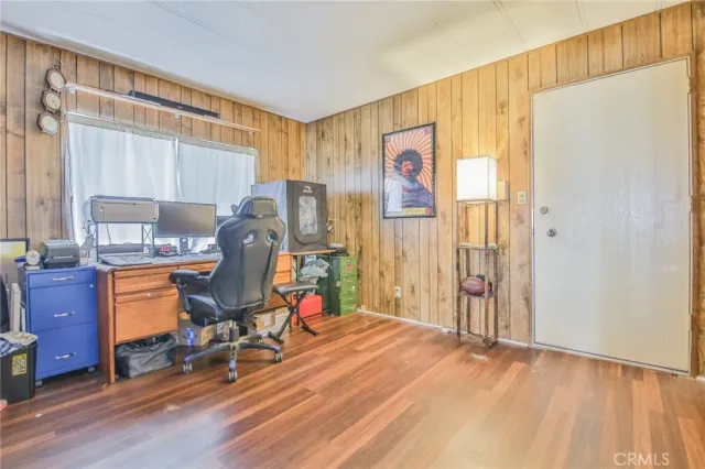 a room with furniture a rug and a window