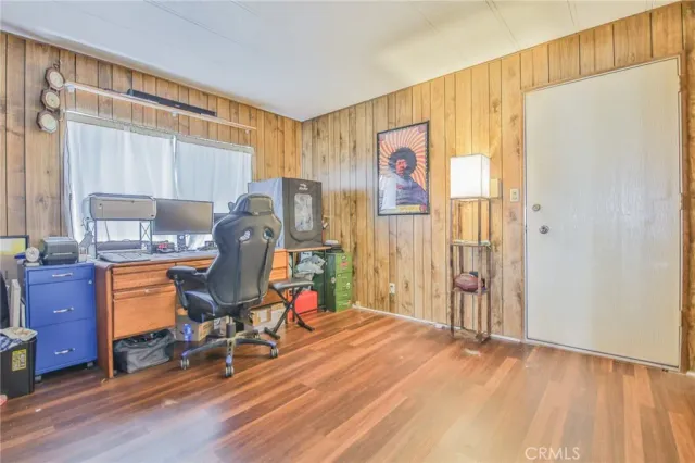 a room with furniture a rug and a window