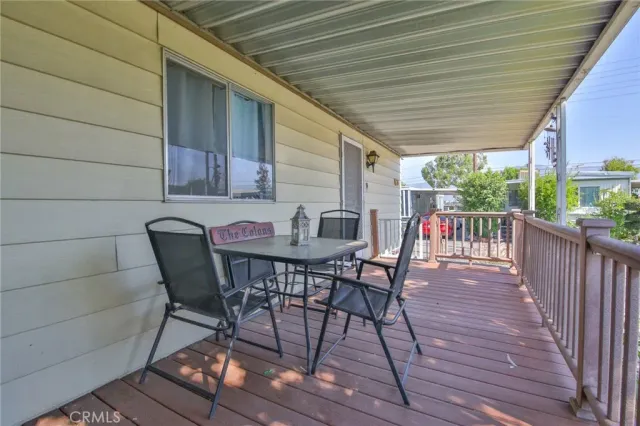 a view of a porch with wooden floor