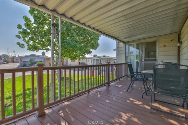 a view of a porch with wooden floor