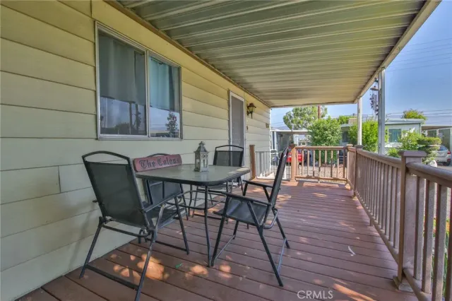 a view of a chairs and table in the balcony