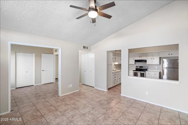 a view of a kitchen with a sink and a refrigerator cabinets