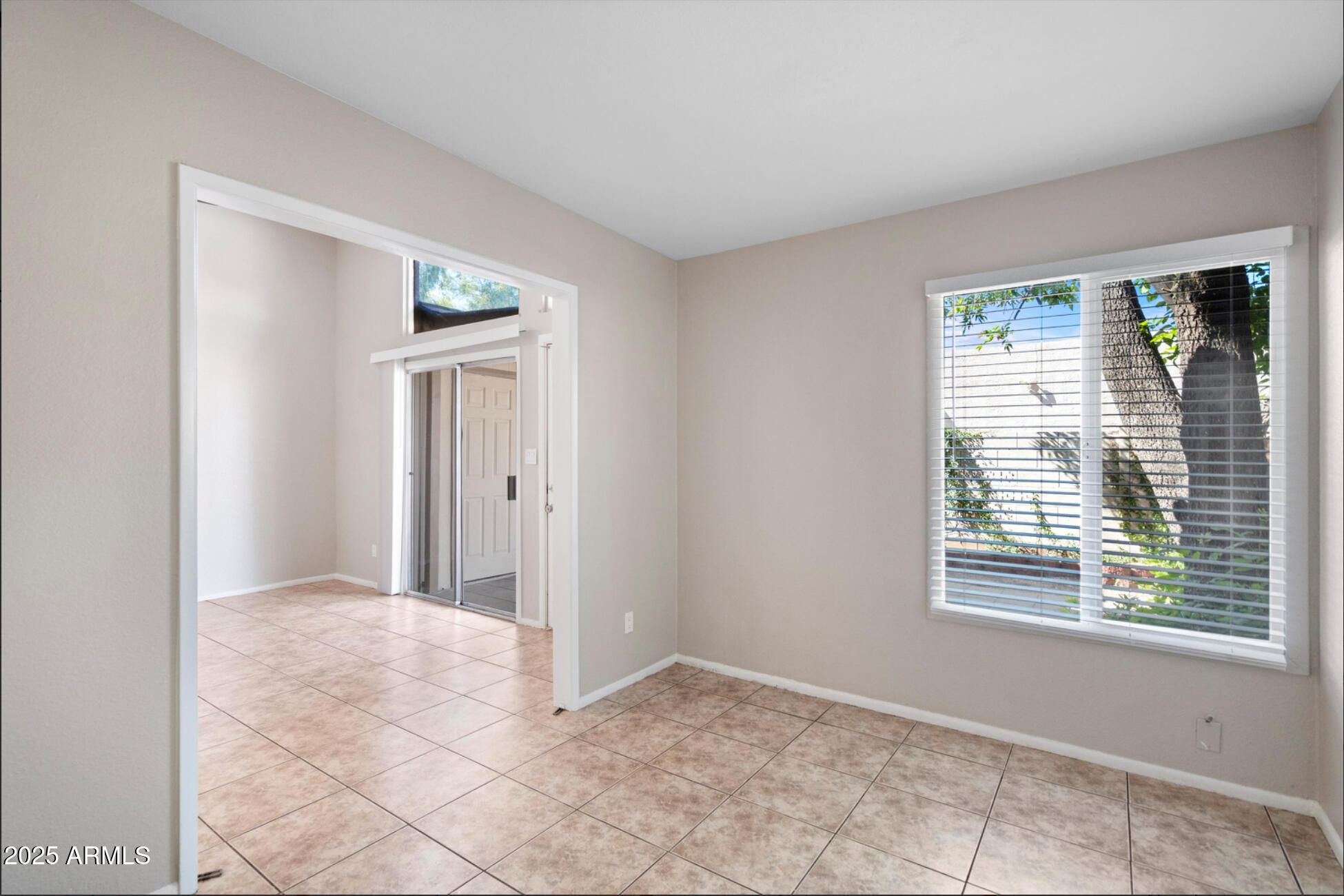555 North May, Unit 23 Mesa, AZ 85201 - Photo 8 of 19 a view of an empty room with window