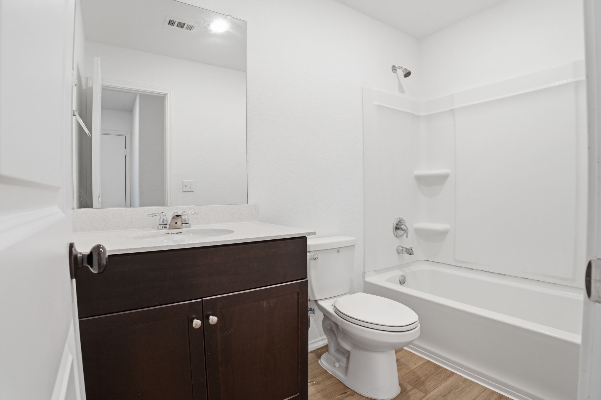 12213 Rising Moon Lane Del Valle, TX 78617 - Photo 14 of 19 a bathroom with a sink a toilet and shower