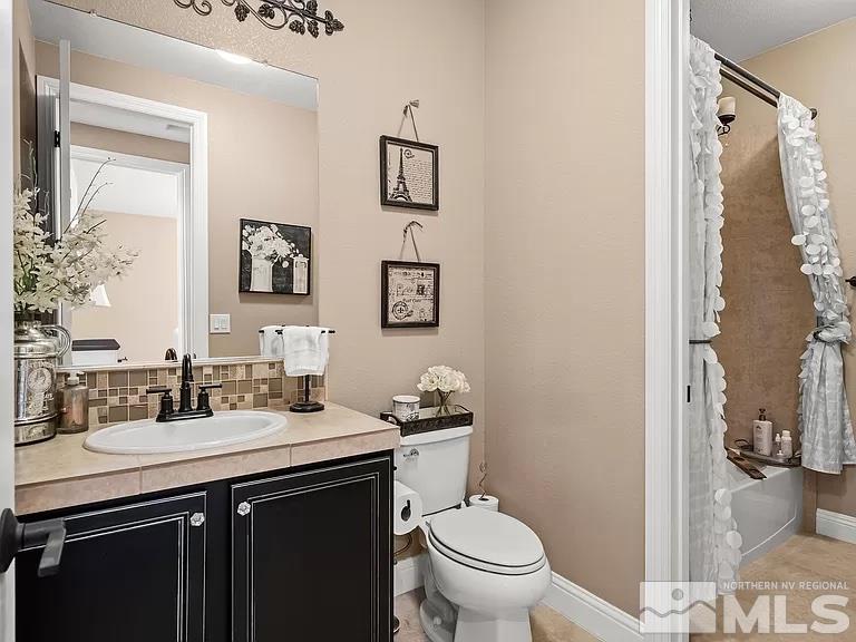 2725 Foxhunter Lane Reno, NV 89521 - Photo 16 of 25 a bathroom with a sink toilet and a mirror