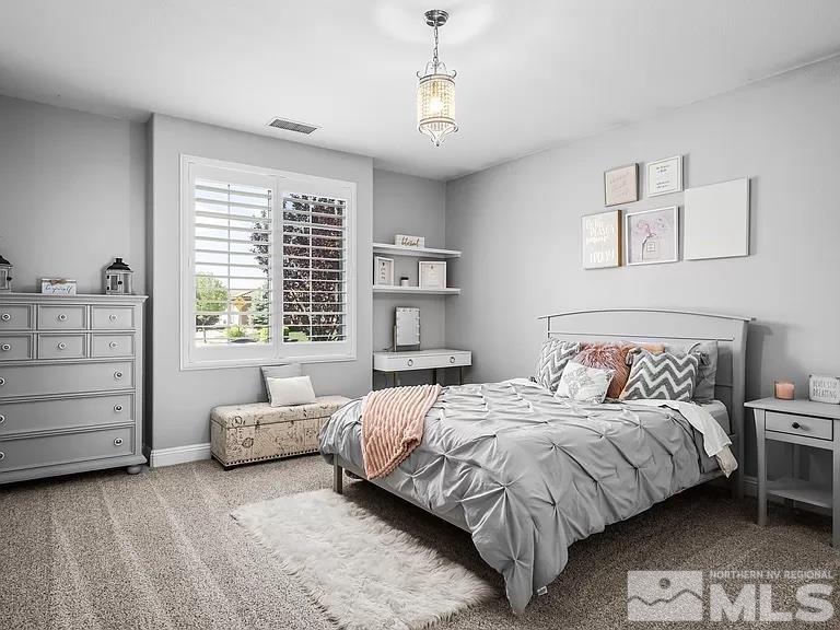 2725 Foxhunter Lane Reno, NV 89521 - Photo 17 of 25 a bedroom with a bed and a window