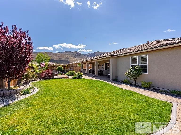 2725 Foxhunter Lane Reno, NV 89521 - Photo 24 of 25 a view of a house with a backyard