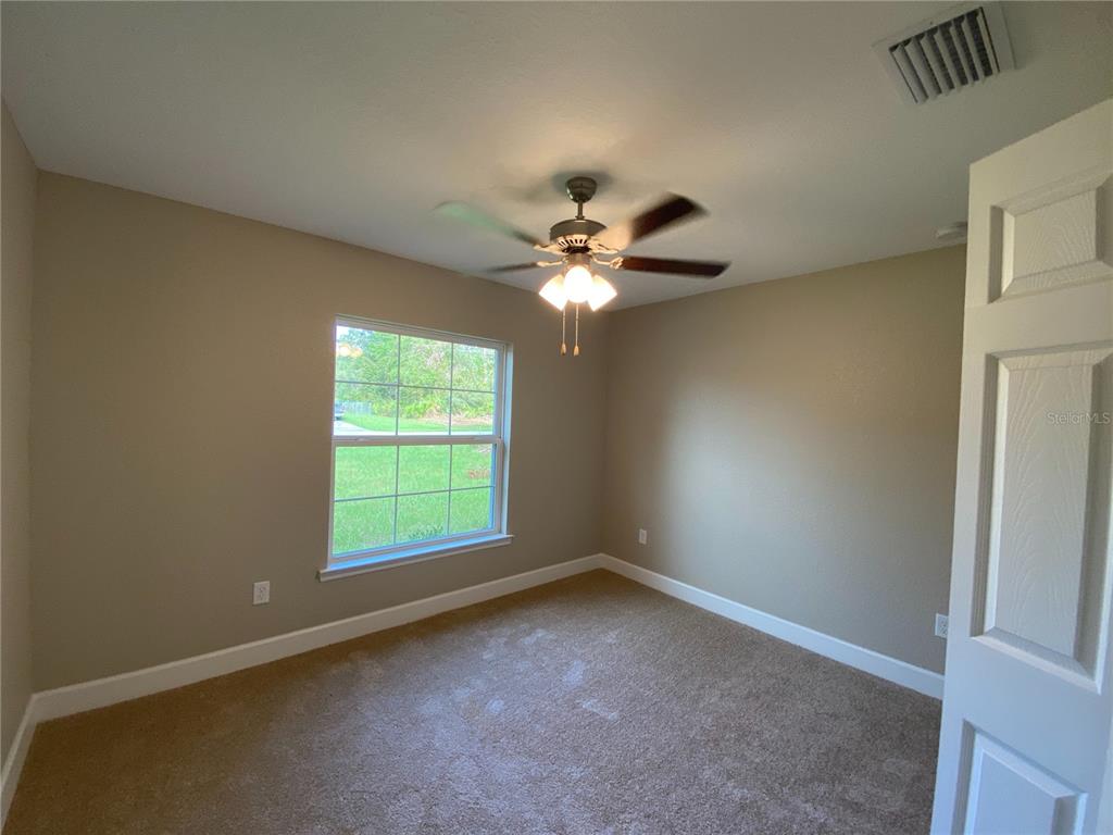 3011 Southwest 140th Loop Ocala, FL 34473 - Photo 14 of 22 a view of an empty room with a window