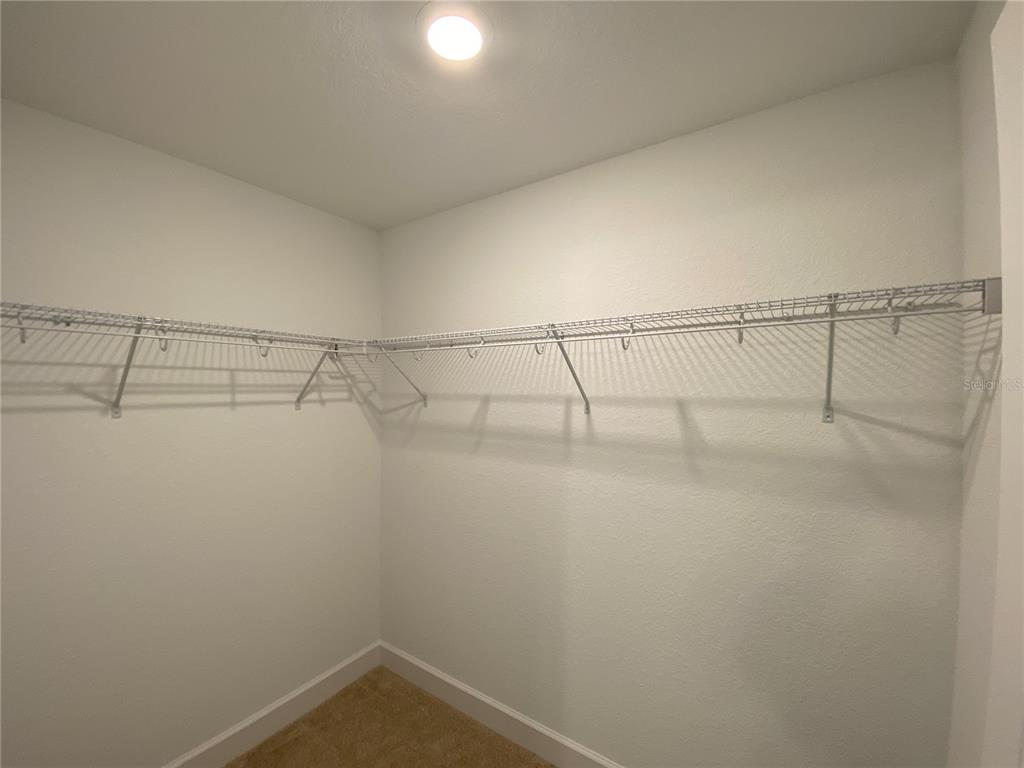 3011 Southwest 140th Loop Ocala, FL 34473 - Photo 18 of 22 a view of a room with racks on the wall
