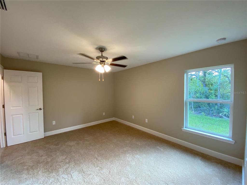 3011 Southwest 140th Loop Ocala, FL 34473 - Photo 19 of 22 a view of an empty room with a window