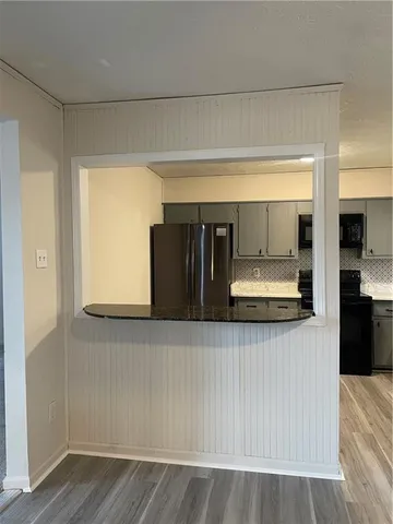 a view of a kitchen from the hallway