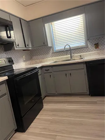 a kitchen with a sink and a window