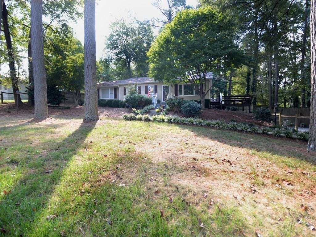 1023 Legend Road Raleigh, NC 27603 - Photo 30 of 30 Set back off the road, this beautiful ranch has a stunning interior and an oasis of a backyard! Exterior Front