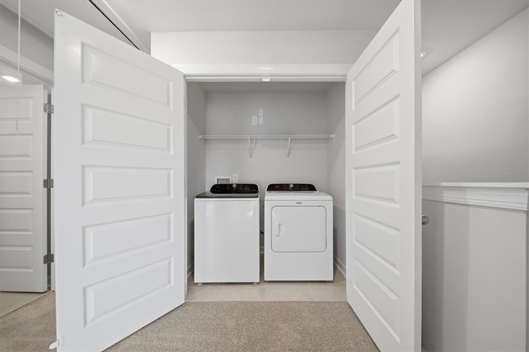129 Kerwin Court Woodruff, SC 29388 - Photo 14 of 30 Functional laundry closet provides convenient space for chores with modern appliances.