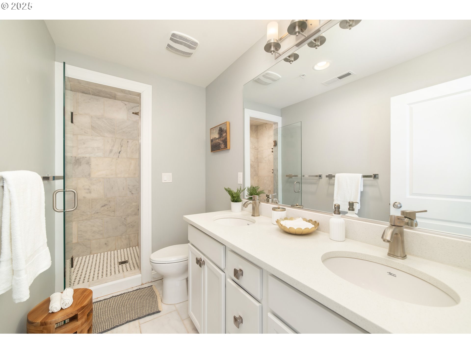 623 Northeast Randall Avenue Portland, OR 97232 - Photo 14 of 26 a bathroom with a granite countertop double vanity sink mirror double shower and bathtub