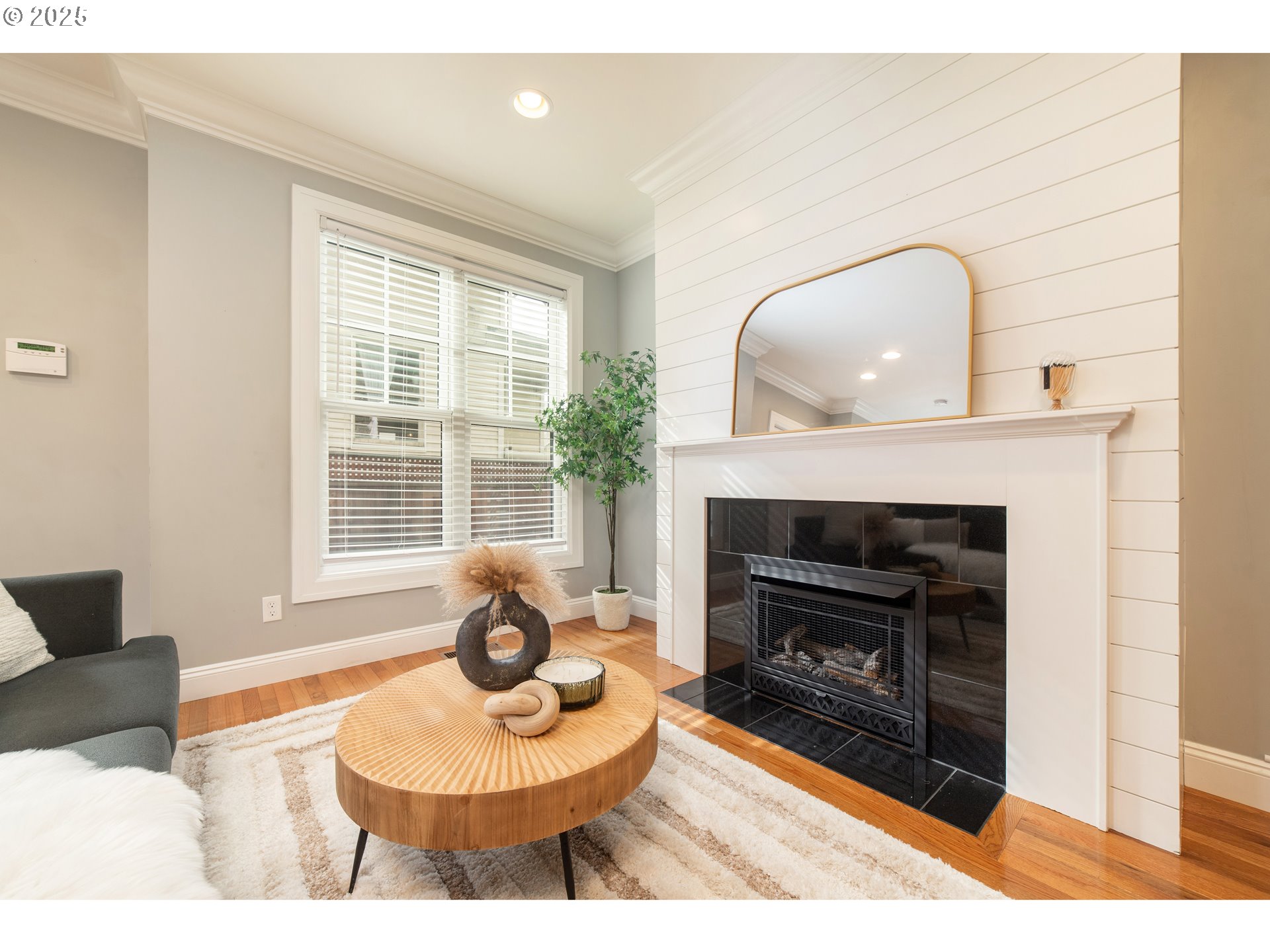 623 Northeast Randall Avenue Portland, OR 97232 - Photo 3 of 26 a living room with furniture a window and a fireplace