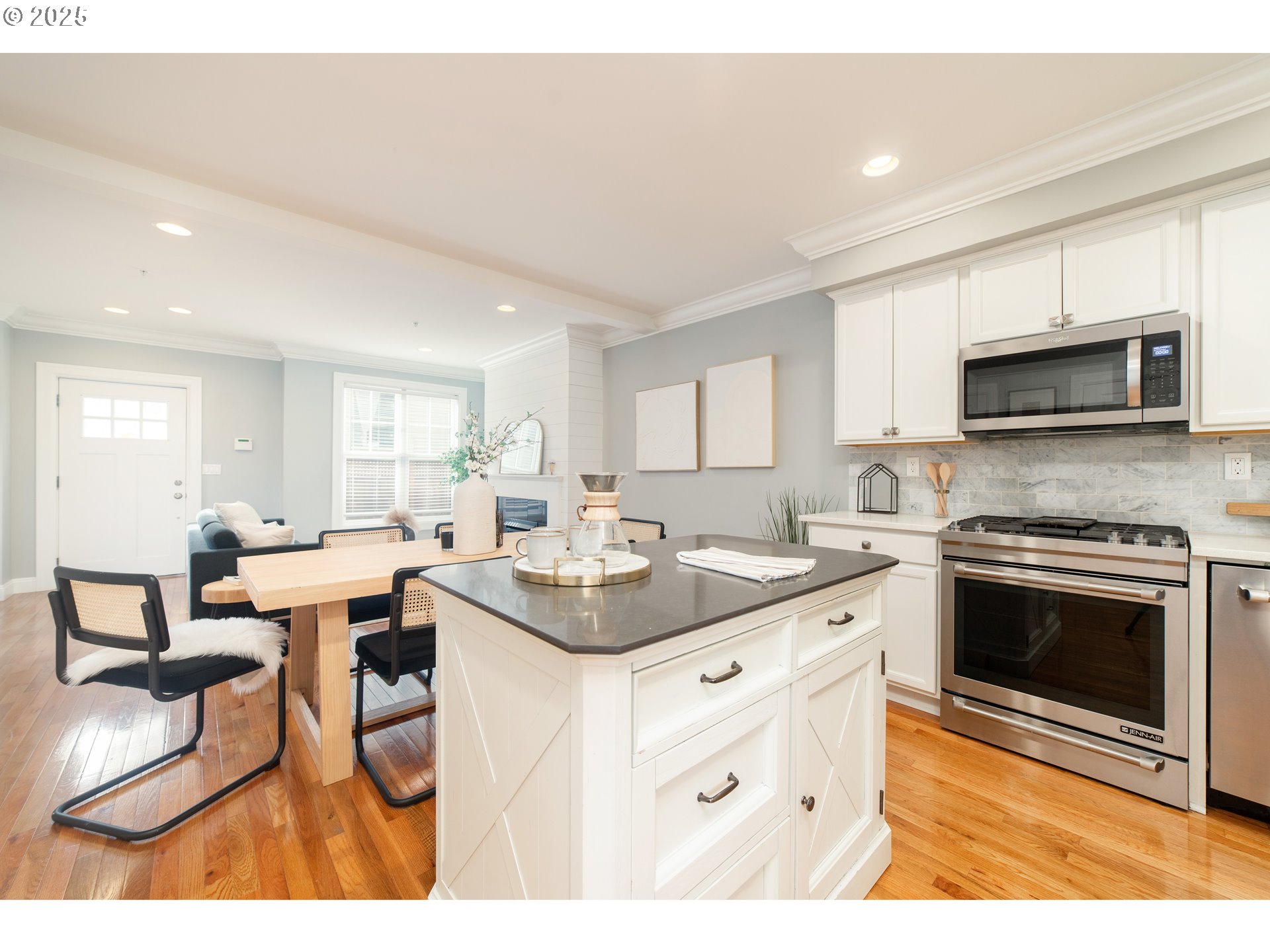 623 Northeast Randall Avenue Portland, OR 97232 - Photo 5 of 26 a kitchen with stainless steel appliances kitchen island granite countertop a sink and cabinets