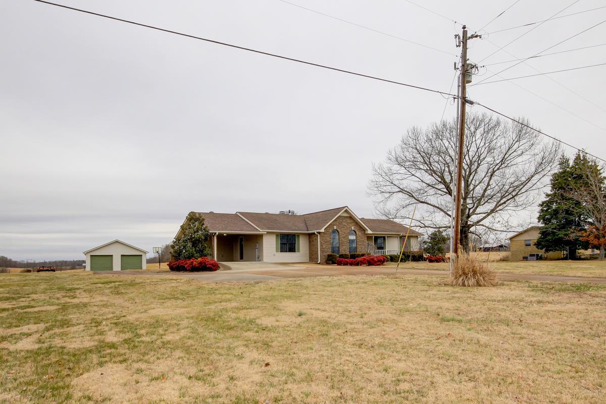 550 Hurricane Loop Tennessee Ridge, TN 37178 - Photo 1 of 18 a view of a house with a yard and sitting area