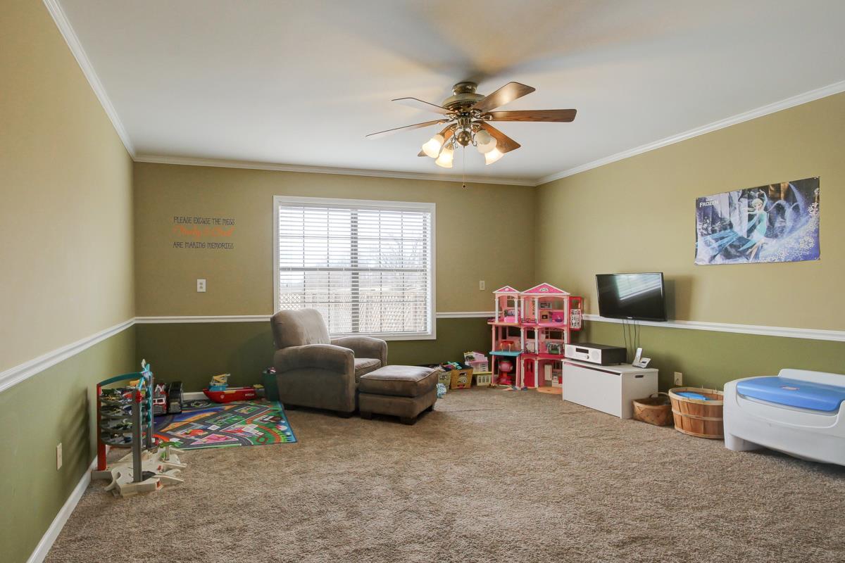 550 Hurricane Loop Tennessee Ridge, TN 37178 - Photo 11 of 18 a bedroom with furniture and a window