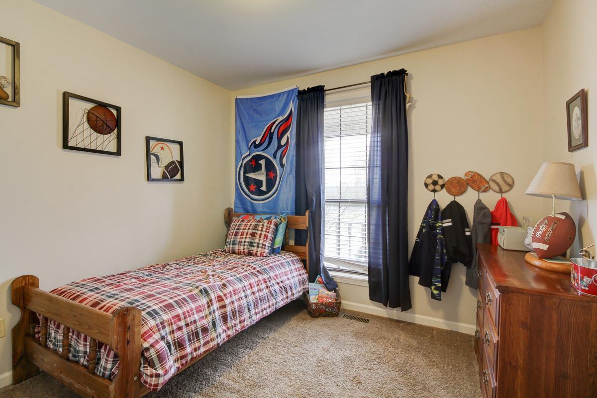 550 Hurricane Loop Tennessee Ridge, TN 37178 - Photo 14 of 18 a bedroom with a bed and walk in closet