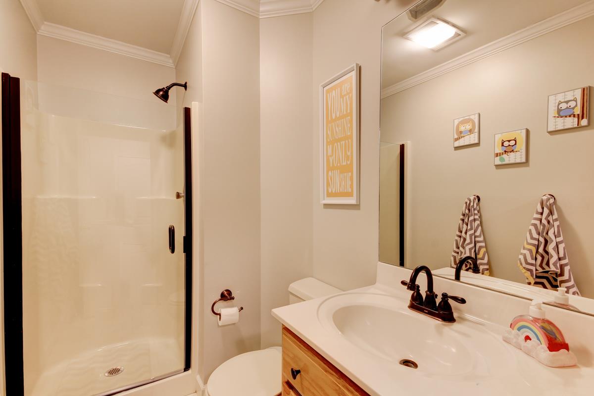 550 Hurricane Loop Tennessee Ridge, TN 37178 - Photo 16 of 18 a bathroom with a sink and a mirror with toilet