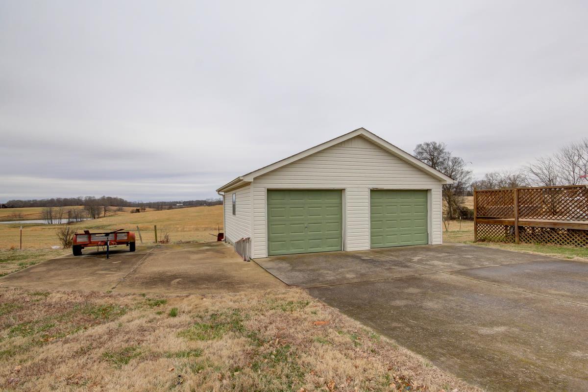 550 Hurricane Loop Tennessee Ridge, TN 37178 - Photo 18 of 18 a view of a house with cars parked in front of a house