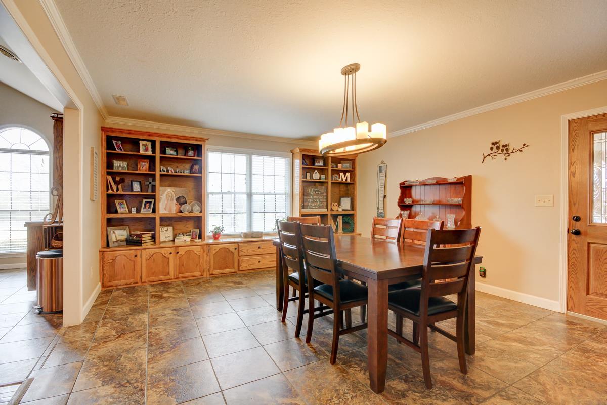 550 Hurricane Loop Tennessee Ridge, TN 37178 - Photo 5 of 18 a view of a dining room with furniture