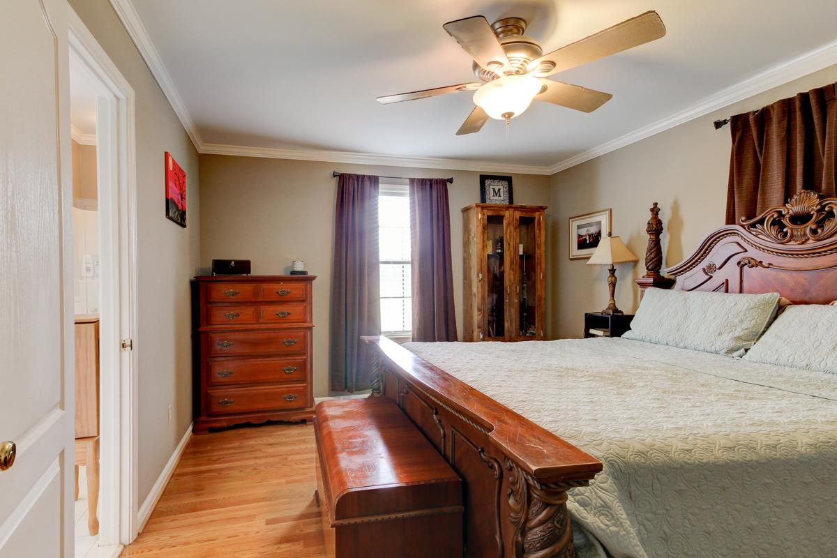 550 Hurricane Loop Tennessee Ridge, TN 37178 - Photo 9 of 18 a bedroom with furniture and a chandelier