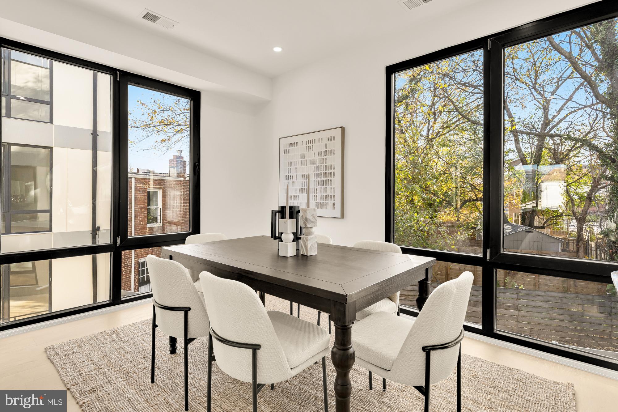 1810 Central Place Northeast, Unit 2 Washington, DC 20002 - Photo 13 of 34 a view of a dining room with furniture window and wooden floor